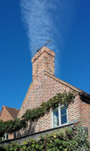 Chimney, rebuild top of chimney in lime mortar and repoint gable After