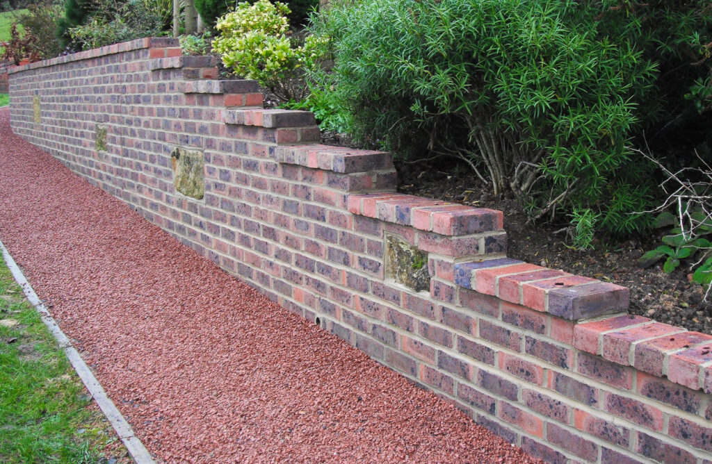 Demolish old wall, rebuild new brick retaining wall After
