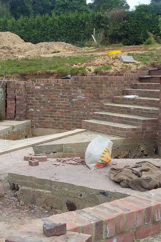 Landscaping, drainage, gate piers, porch 27