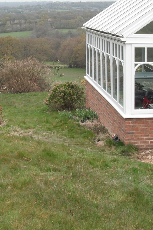 Landscaping, drainage, gate piers, porch before 2
