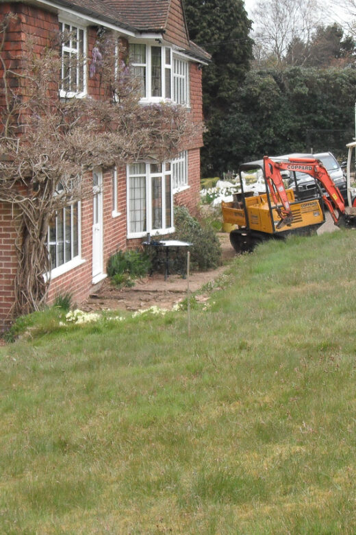 Landscaping, drainage, gate piers, porch before 3