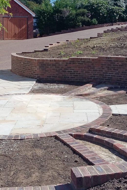 Landscaping, drainage, gate piers, porch after 2